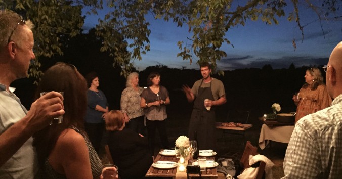 Chef Dustin Busby, formerly of Blackberry Farm, now manager of the Century Harvest Farms kitchen, explains the evening menu. Located in Greenback, Tennessee, the farm owned by Christopher and Shona Burger, specializes in 100% grass-fed beef, pastured pork, chicken and eggs and seasonal vegetables and uses organic and sustainable farming practices. The Burgers alternate crops, cultivate legumes and use the fertilizer produced naturally by the farm’s animals. 